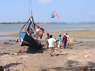Lifting fishing boats from tsunami destruction